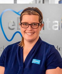 Female staff of eDental Perth wearing a uniform, namely Jamie Lee; clinic coordinator.