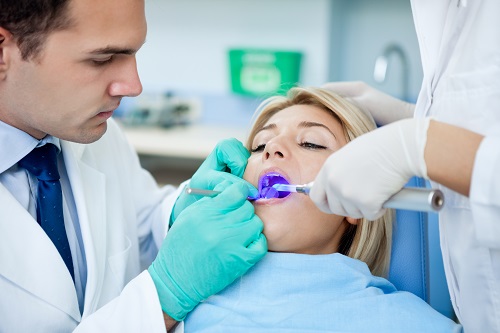 Dentists examining the patient's teeth and that represents the 