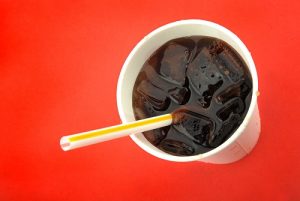 Closed-up of a soft drinks on cup with ice and straw and as the header image of 