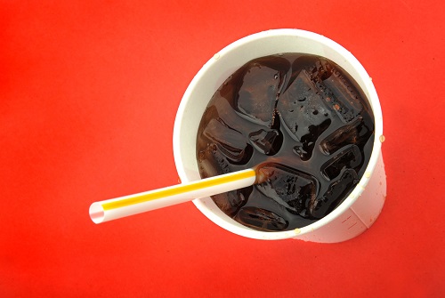 Closed-up of a soft drinks on cup with ice and straw and that represents the 