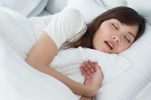 Woman sleeping with mouth opened and that represents the 